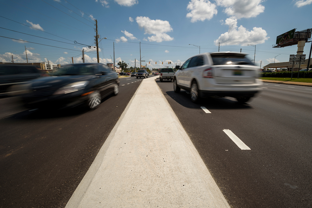 Image of cars driving through traffic