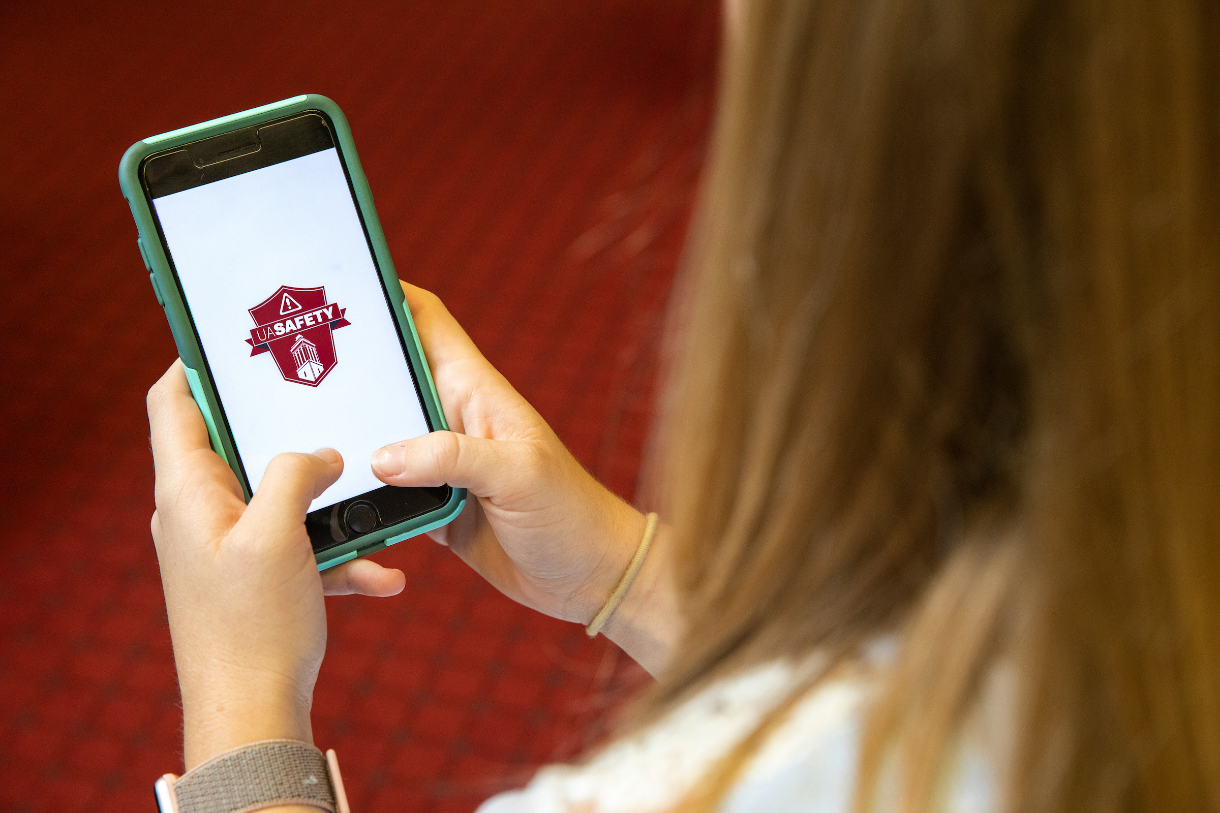 Image of student using UA Safety App